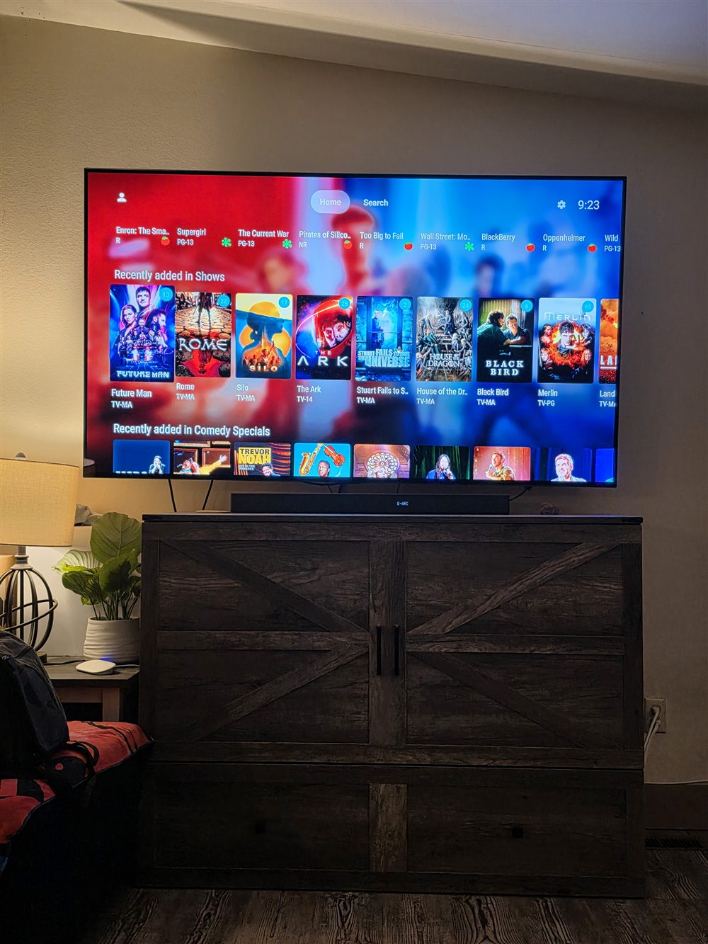 Jellyfin Shows and Comedy Specials rows on a wall-mounted TV